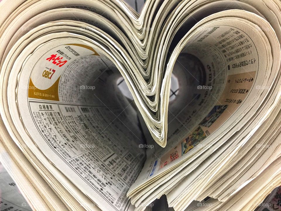 Finding everyting around us to take photo, Newspapers in a box at supper market that looks like a heart shape