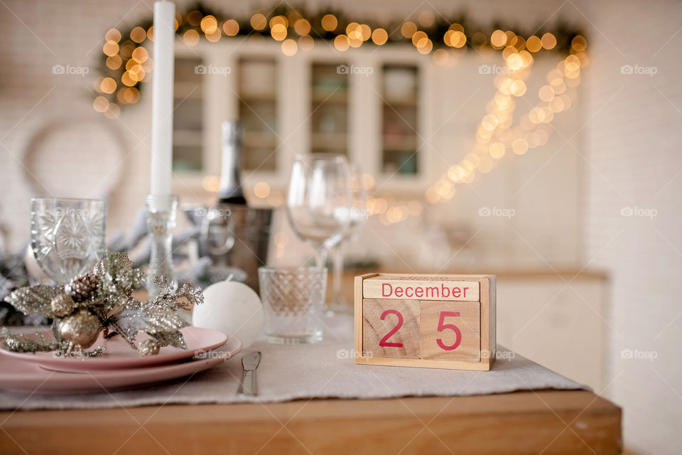 Christmas background with wooden block calendar with the date of December 25