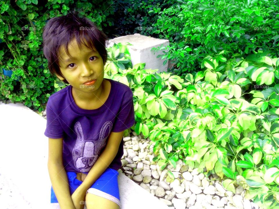 asian girl sitting a plant box