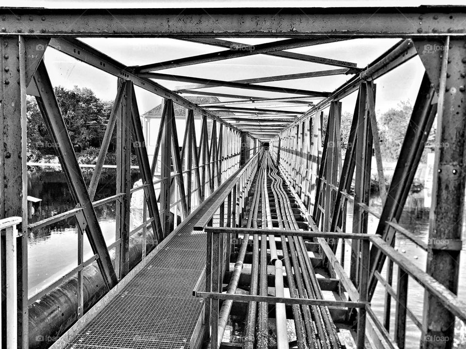 Metal railway bridge over a canal in the Ruhr area