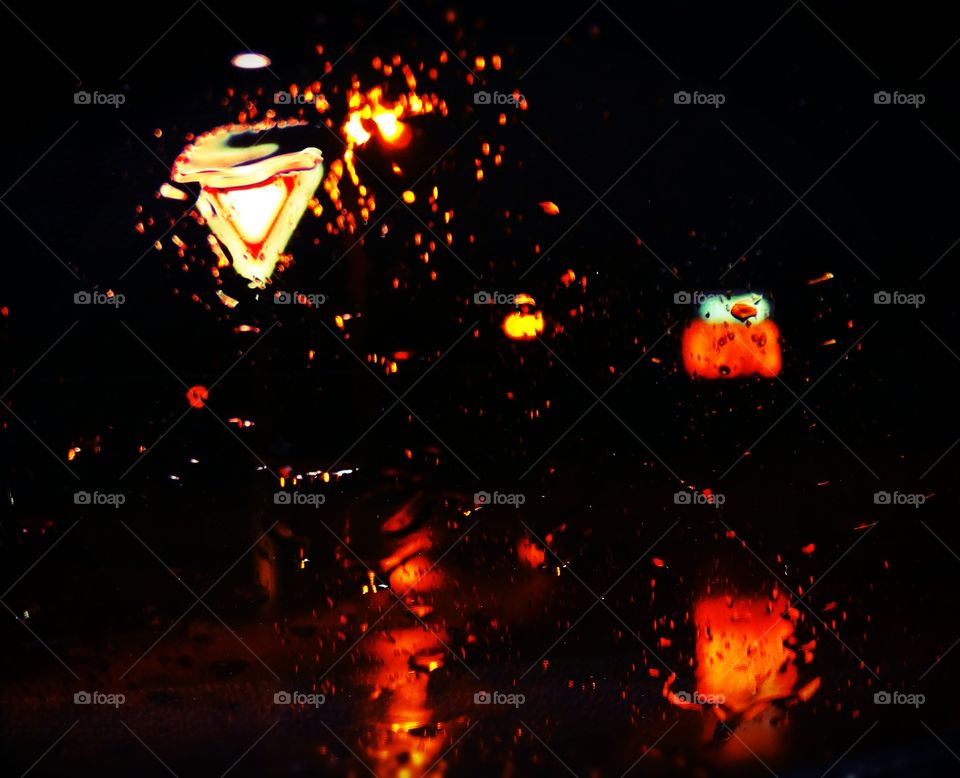 Yield sign at dusk in the rain