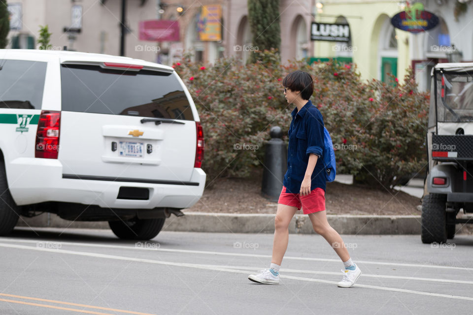 Girl crossing the road 