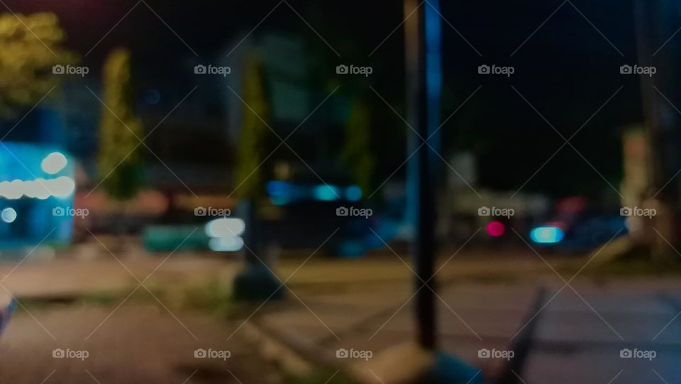 Defocused abstract background of city street at night with street lamp lighting. 
Blurred cityscape,Lighting night at tourist attraction colorful.