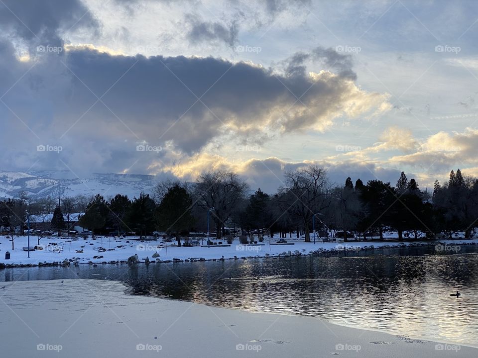 A winter wonderland on the lake. Scenic cloudscape. 