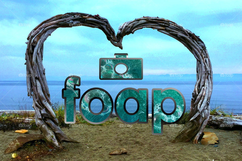 Hey it’s true; I love FOAP! It’s a desktop made Foap logo & name inside a driftwood heart on a beautiful beach. The photo within is the Foap turquoise & some purple food colour dyed bubbly water all framed by a silvery border to match the driftwood. 