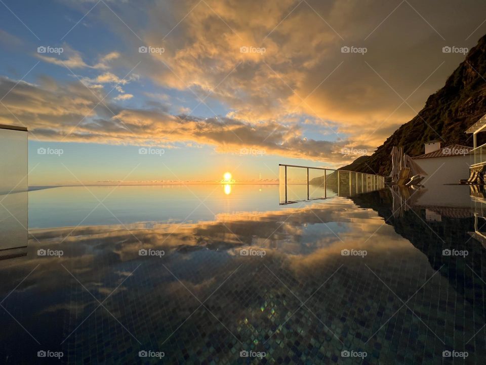 Sunset over a infinitypool in madeira