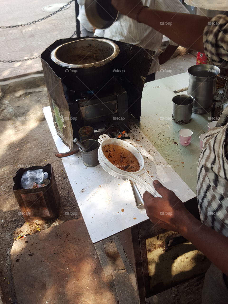 Indian Tea Kiosk owner preparing tea for customers