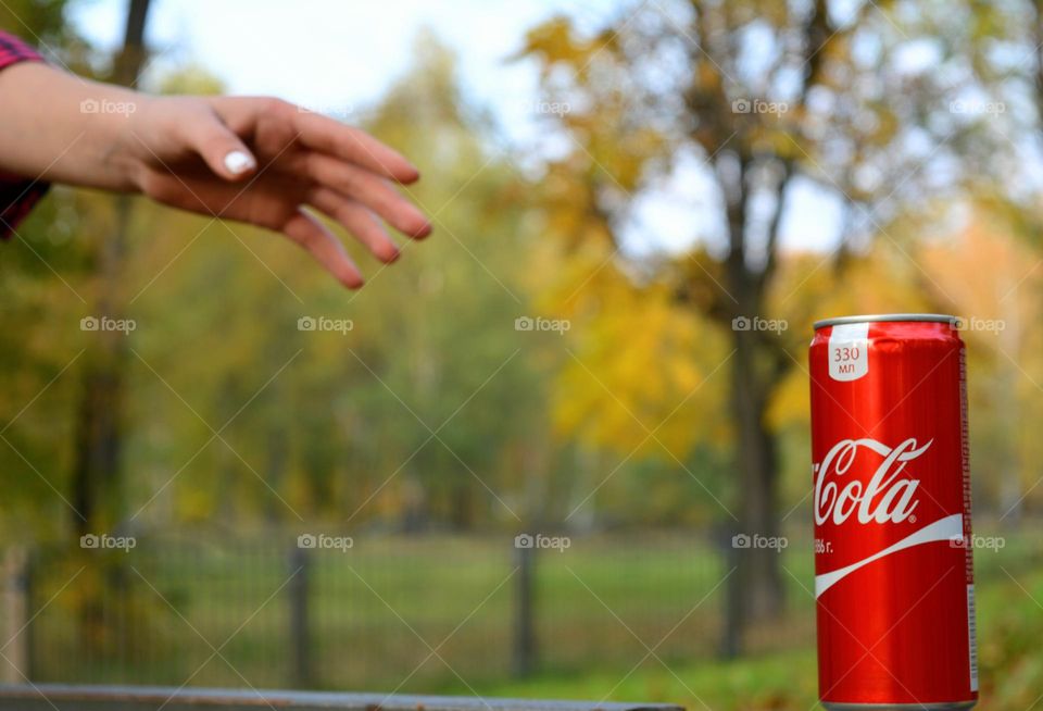 coca cola and hand person