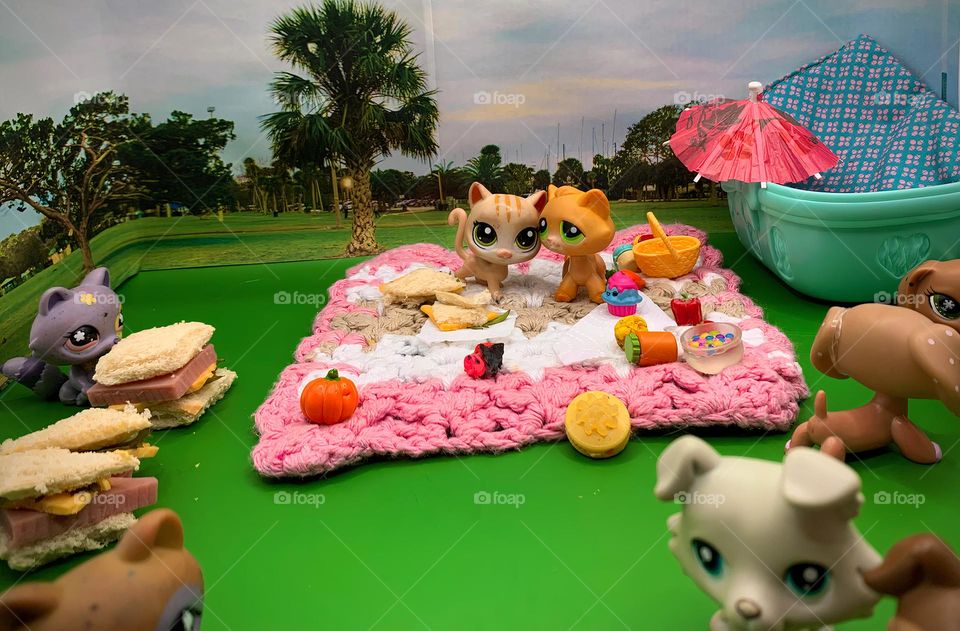 Characters LPS Toys For Kids Having A Picnic Scene With Our Exclusive Personal Photo Background From The Park In A Tropical Environment Looking At An Actual Real Mini Sandwich.