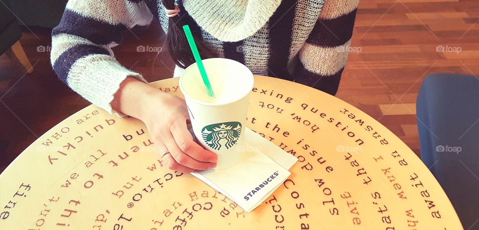 A girl with a cup of coffee