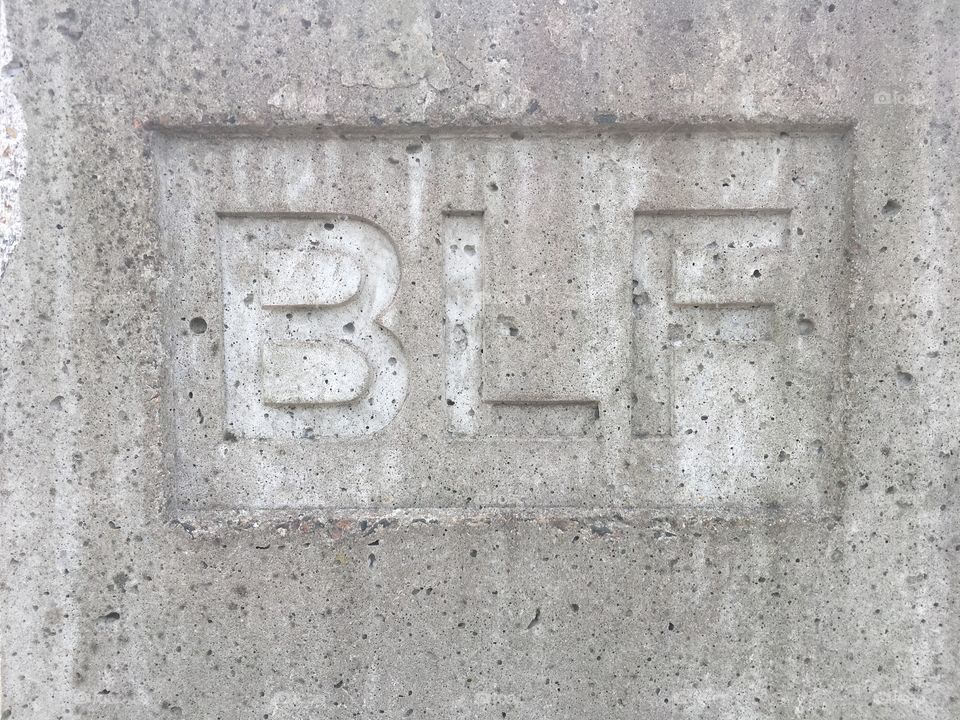 Big piece of concrete slab with letters