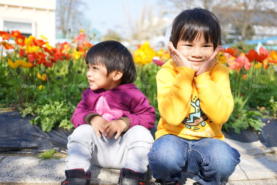 Happy Japanese children in flower park