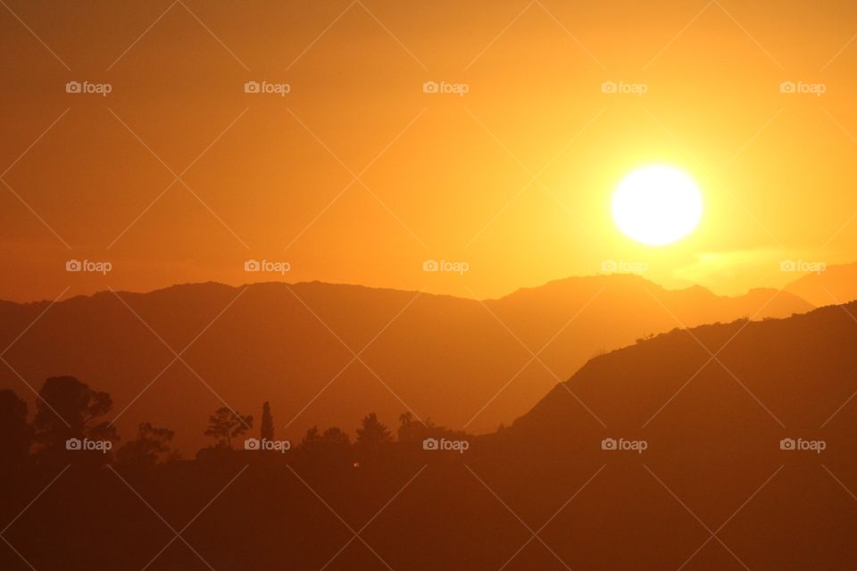 Los Angeles Sunsets. the view of an orange haze sunset from the Griffith Observatory