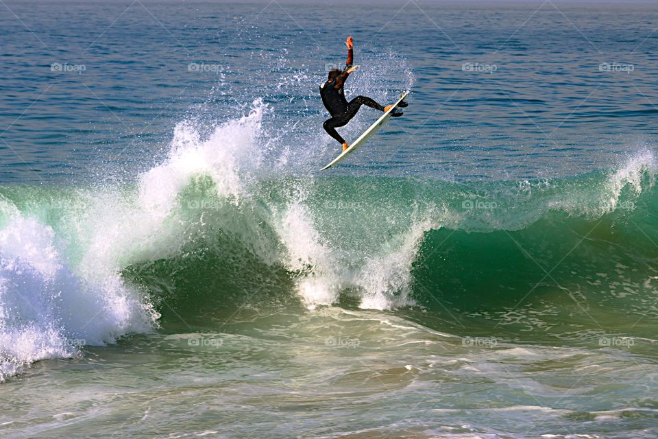 Surfer surfing on surf