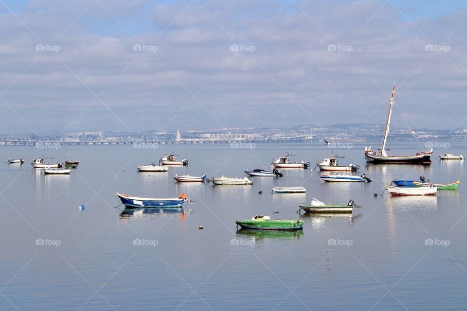 Boats in a calm, blue, pacific River 