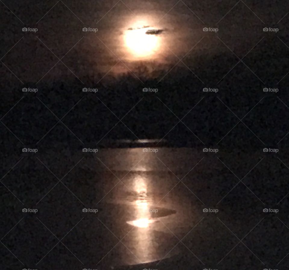 Winter Stories, winter, story, night, darkness, dark, cold, freezing, freeze, froze, frozen, water, lake, ice, moon, sky, clouds, weather, float, floating, melt, melting, moon, celestial, moonlight, reflect, reflection, moonrise, ripples, contrast,season, seasonal, change, climate, climate change, unseasonably warm, warm, unseasonable, storm