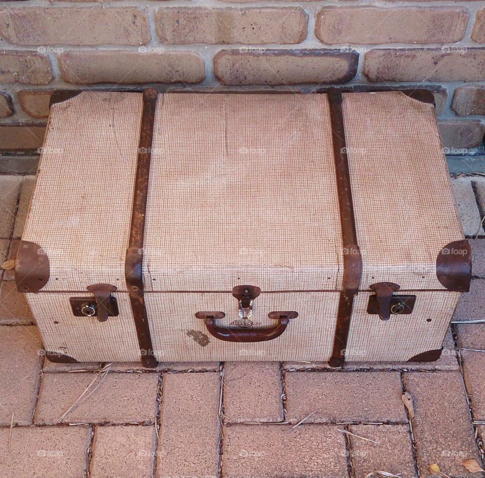 Vintage Suitcase . Older style suitcase with wooden straps.