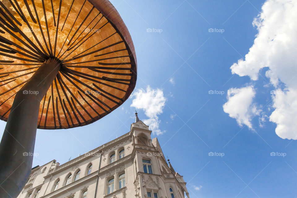 City decoration in the shape of the mushroom against the blue sky