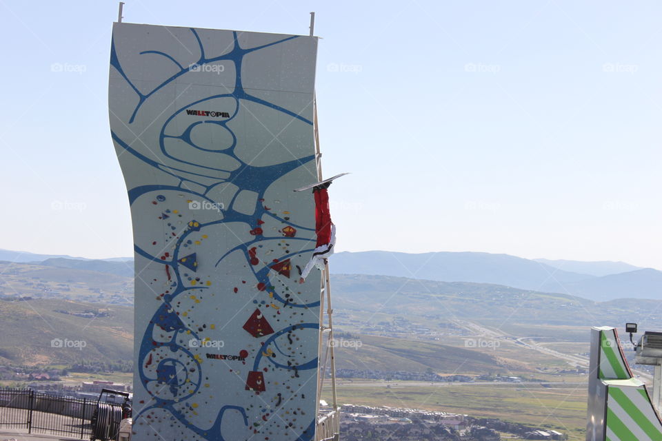 Ski jump practice. Ski jumper mid flight.  