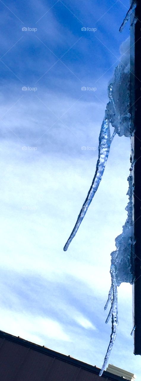 Icicles form during a sunny summer day at McMurdo Station, Ross Island, Antarctica.