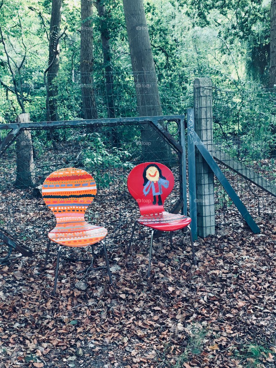 Creepy chairs in the middle of a forest