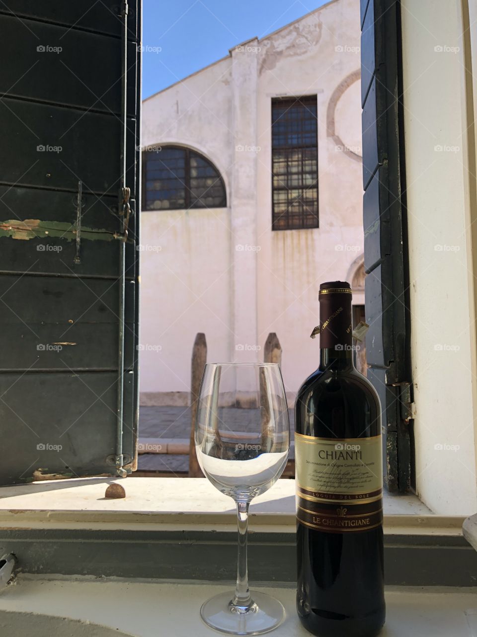 Wine at a Venetian window in Italy 2018