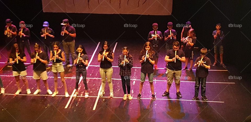 group of children playing flute, soft and delicate musical instrument