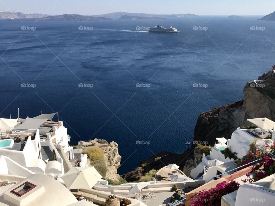 Cruise ship navigating Santorini’s caldera