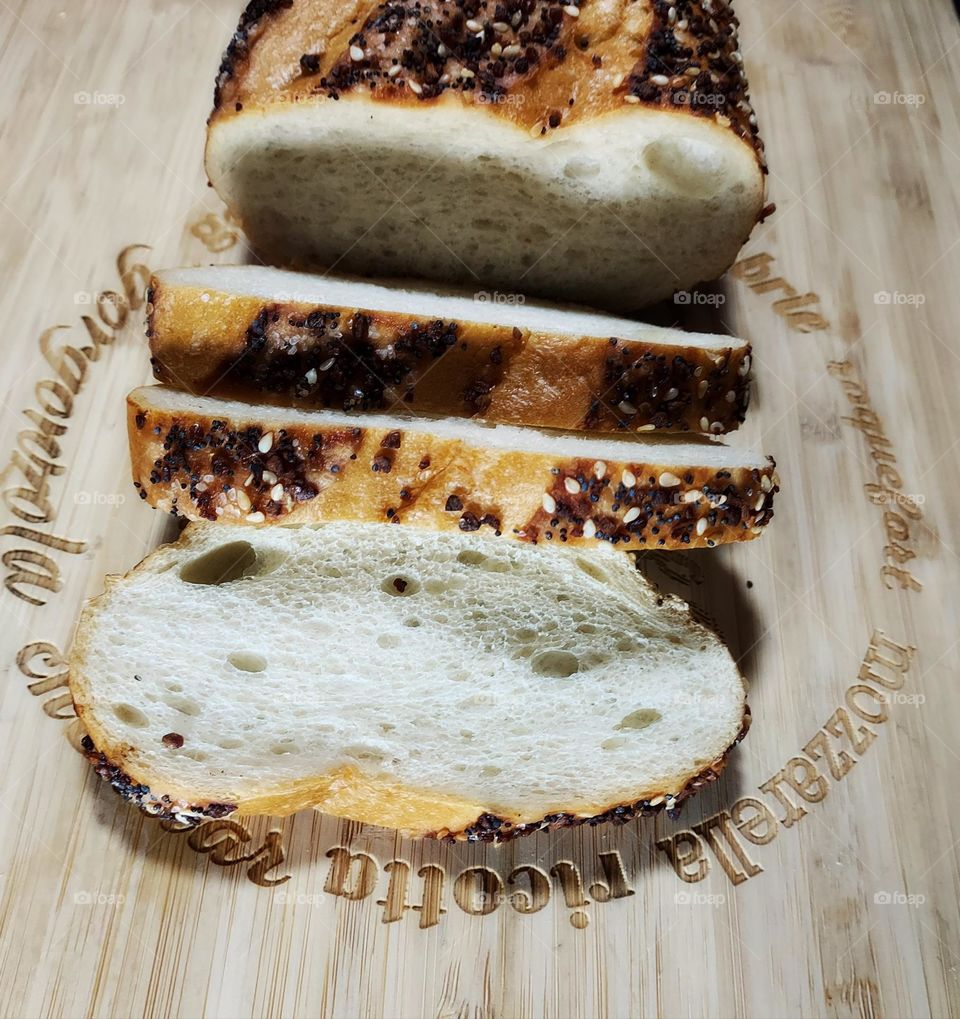 delicious Sesame brand laying on a wooden cutting board