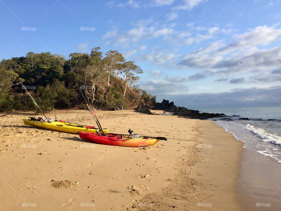 Kayaking at tranquil Palm Cove beach