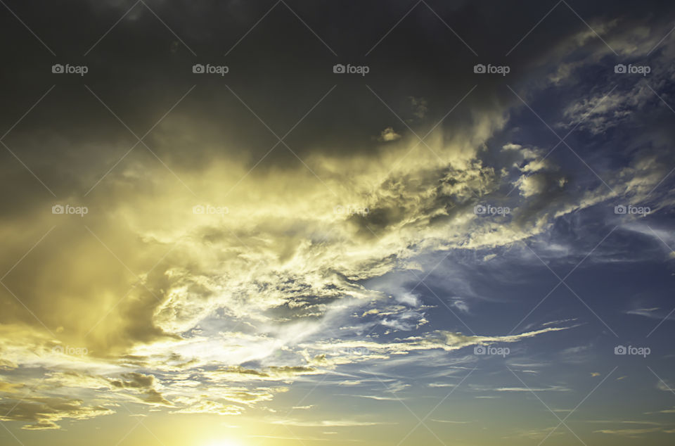 The beauty of the sky with clouds and the sun.