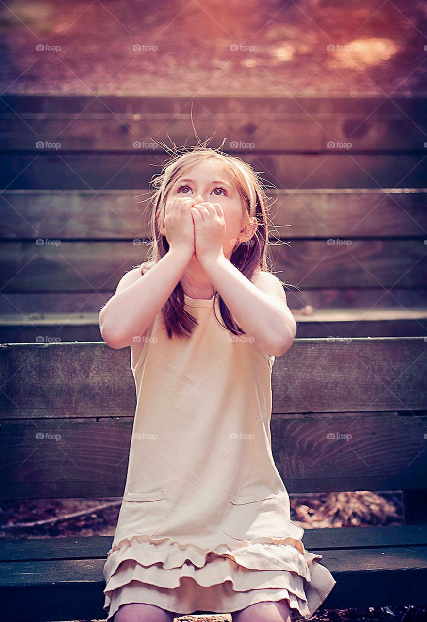 My daughter, very excited to look up at the Redwood Trees