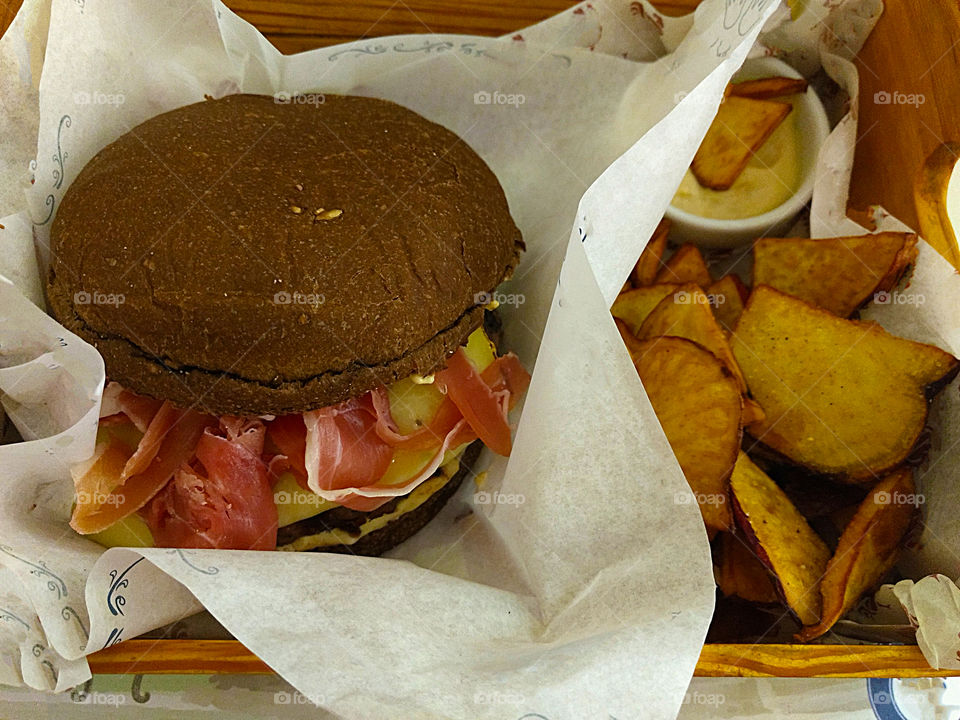 Delicious homemade burger with potato wedges