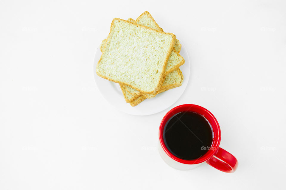 Coffee cup and bread on the table 