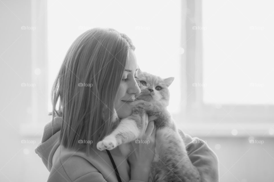 Young woman with cat.