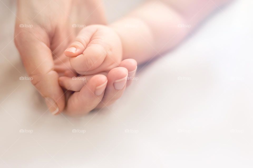 baby's hand in a mother hand