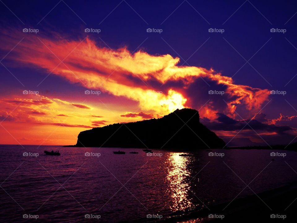 Sunset over Islet of Dino ( Italy ).