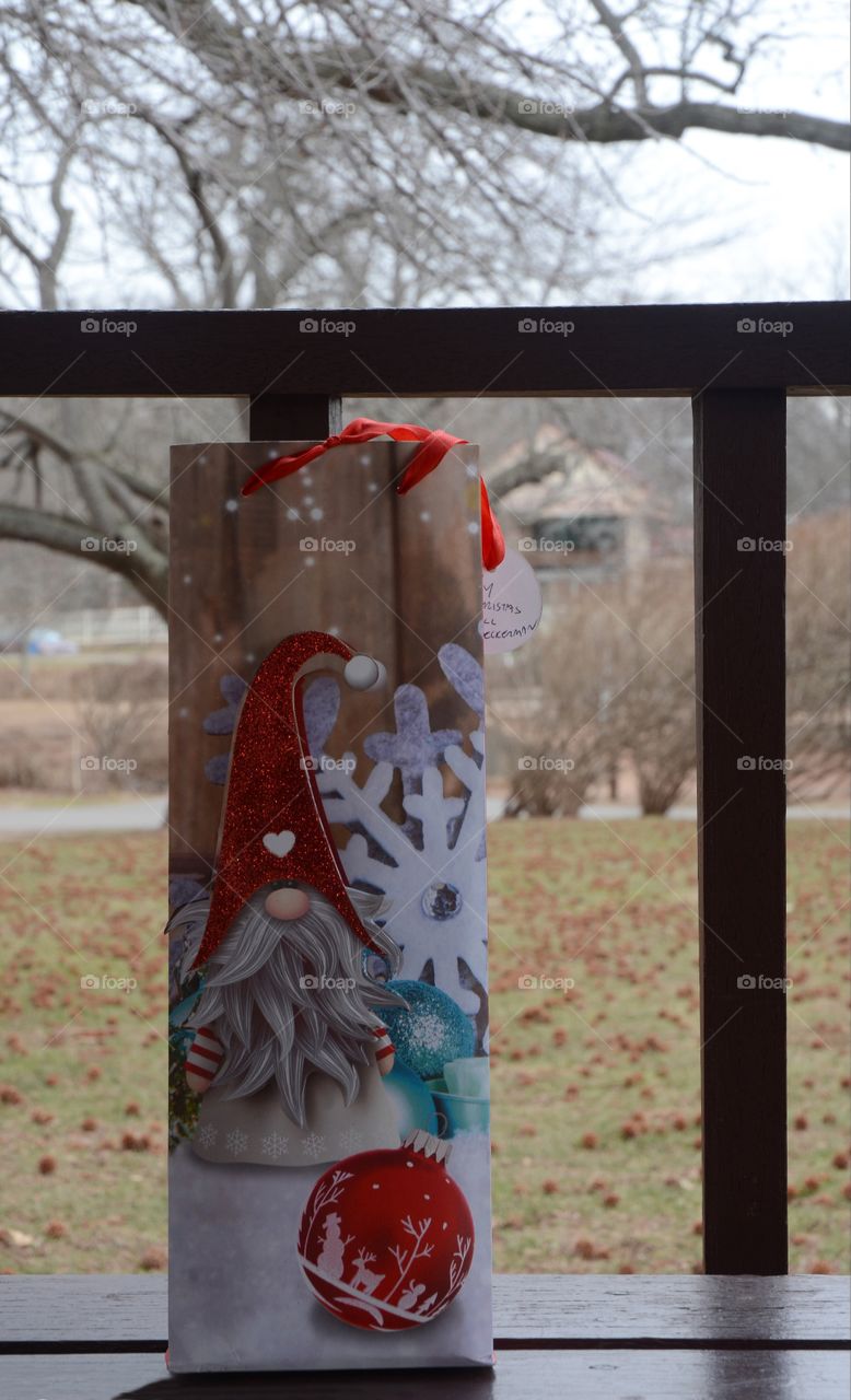 A christmas gift is left behind on a gazebo bench in a nearby public park.