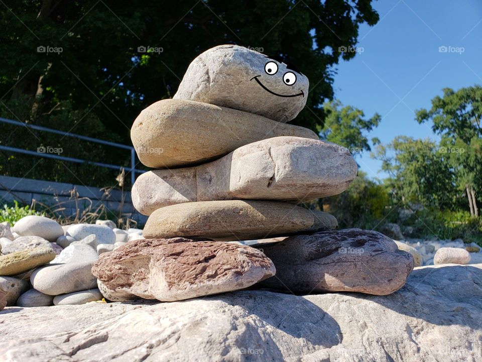 Happy inuksuk rock sculpture