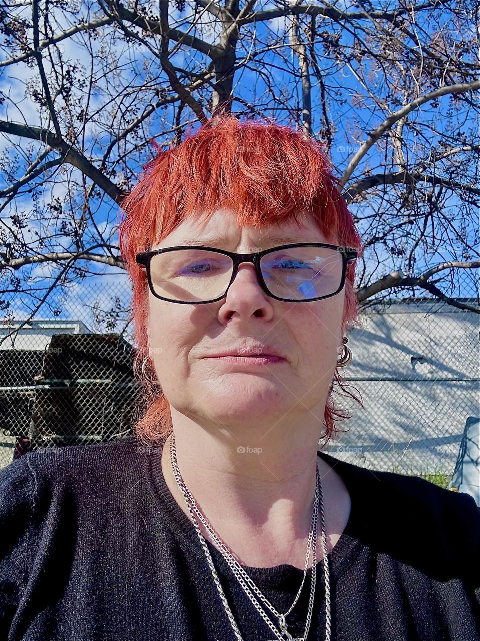 This is me, “Petra Schiller” a.k.a. “Maxine Firefox” outside aboard “Salvation”, the “28 foot 1969 Luhrs” cabin cruiser at “Newtown Creek” by the “Pulaski Bridge” in LIC, Queens letting the sun shine on my face. 2024. Hypnotic Productions