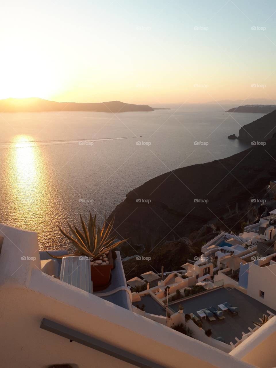 Sunset at the best balcony in the world. 
Beautiful sea. 
Golden sun. 
Panoramic scenery....