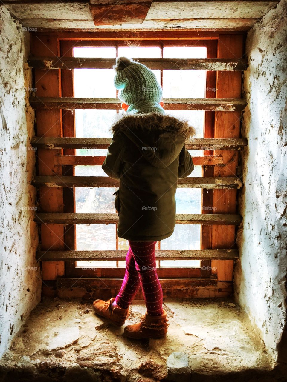 Little girl in old building