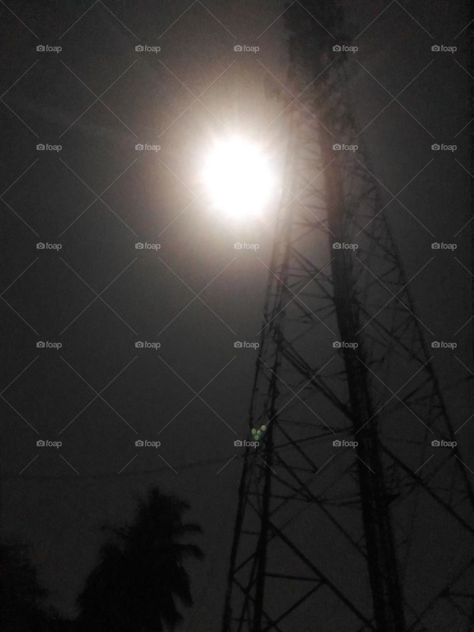 A mobile tower in the light of full moon night