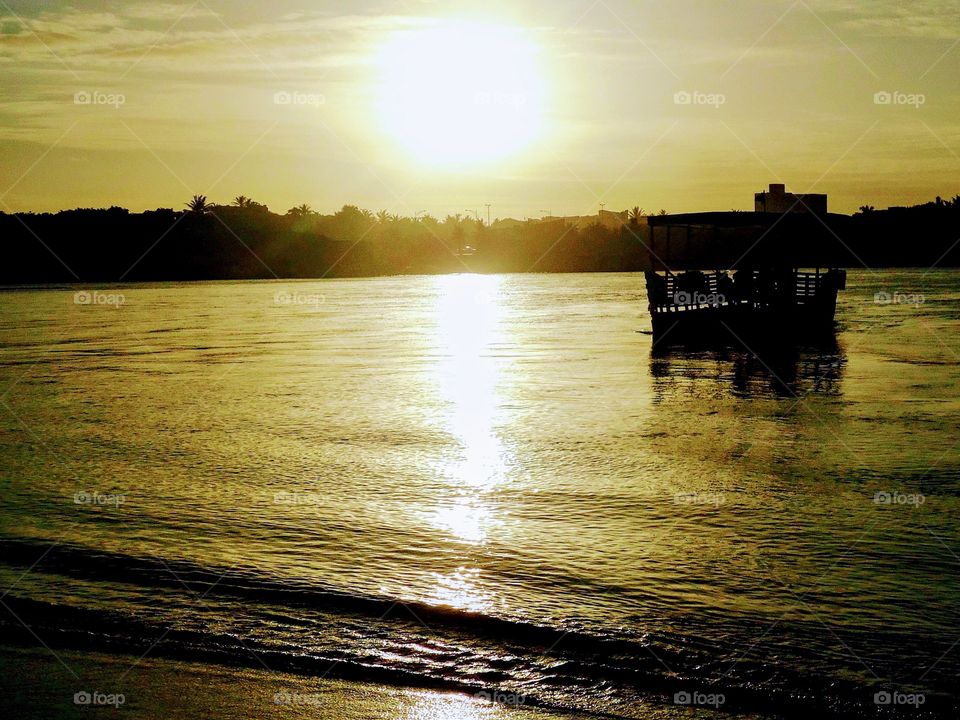 Boat silhouette on the beach