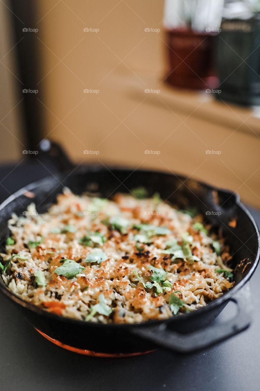 A scrumptious orzo morning pasta complete with chicken sausage, garlic, tomatoes, spinach, parsley, and mozzarella, topped with a crispy parmesan breadcrumb crust. Broiled in the oven in a cast iron pan for added taste. 