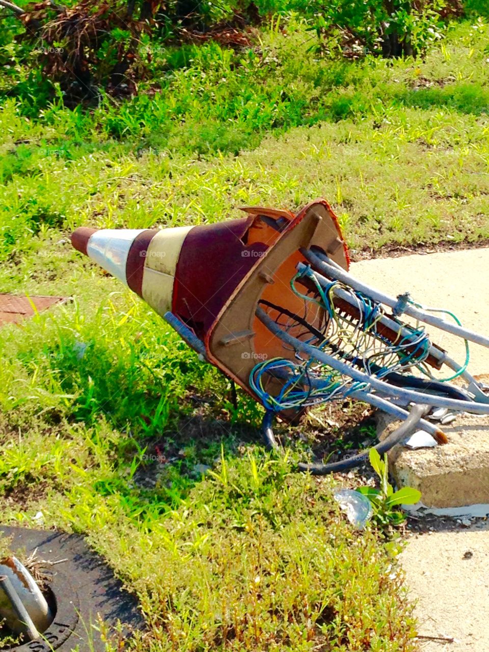 Why wires in it & why run over. Stuck in traffic saw this cone full of wires had been run over! Laughing, wondered ? damage done. Also ? Light up maybe?