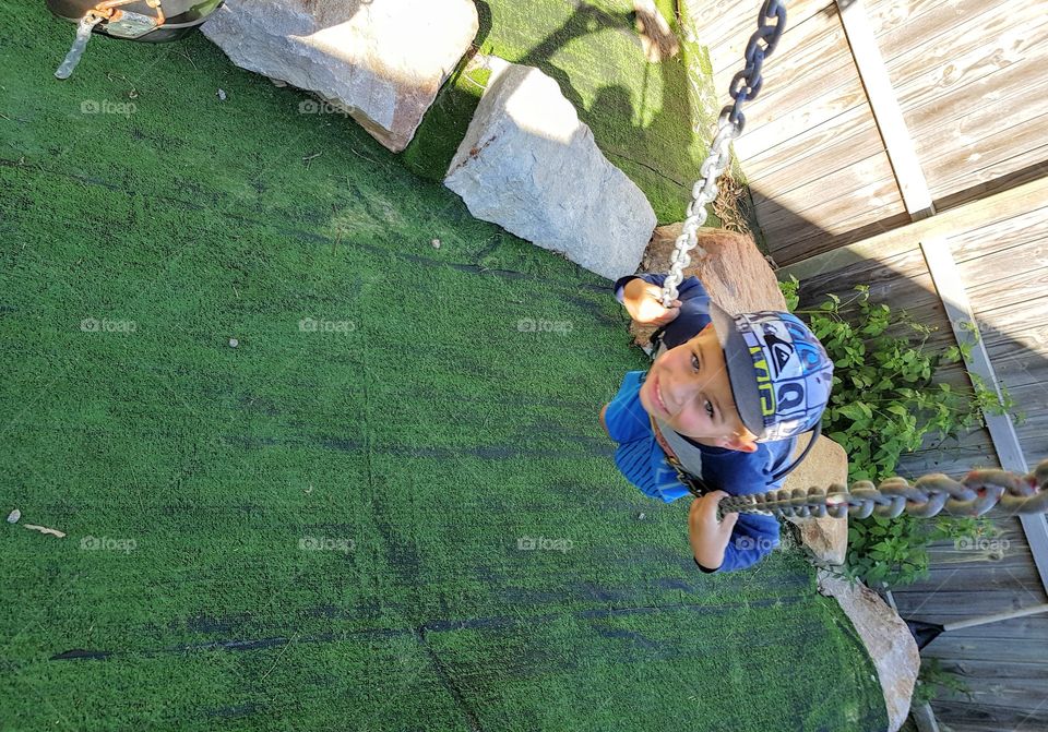 kid on swing