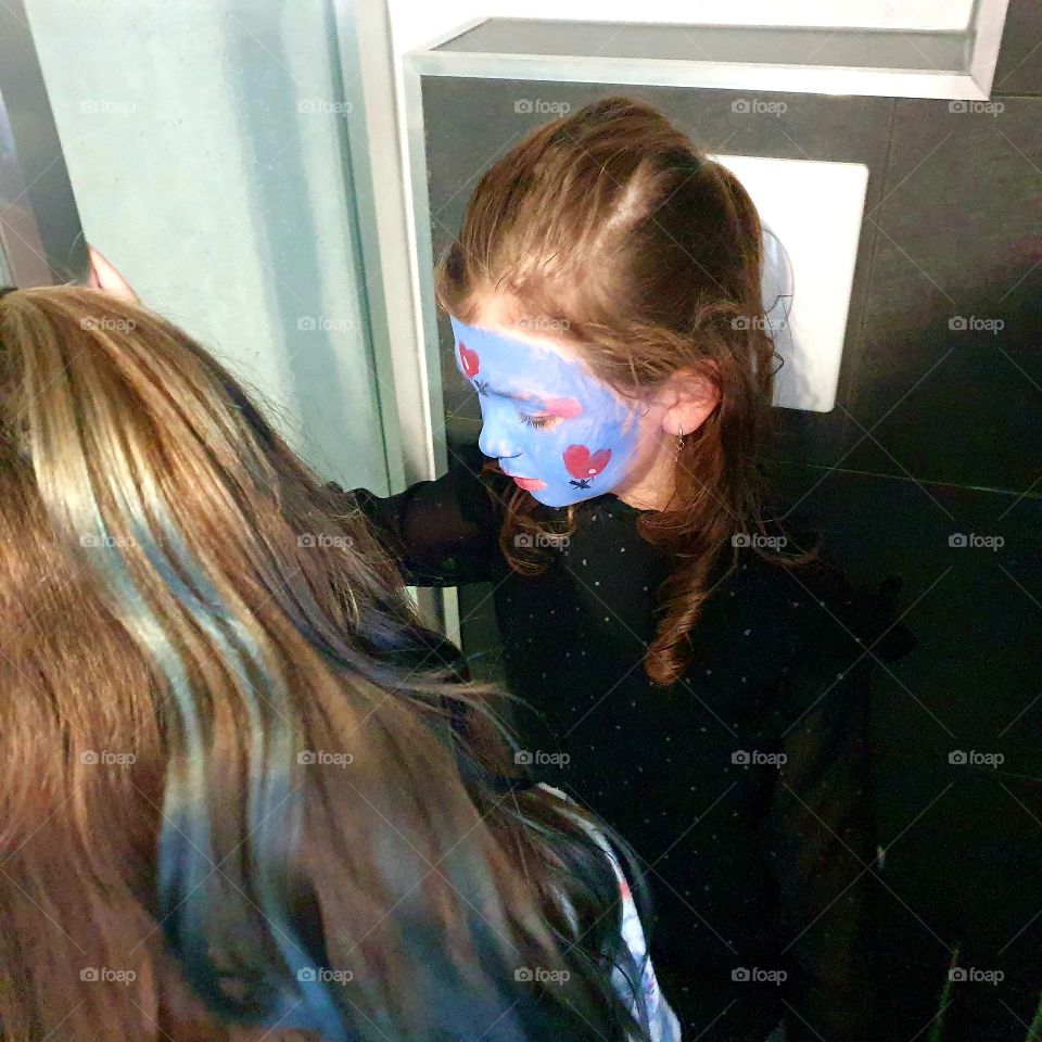 face painting and having fun.  vacation time.