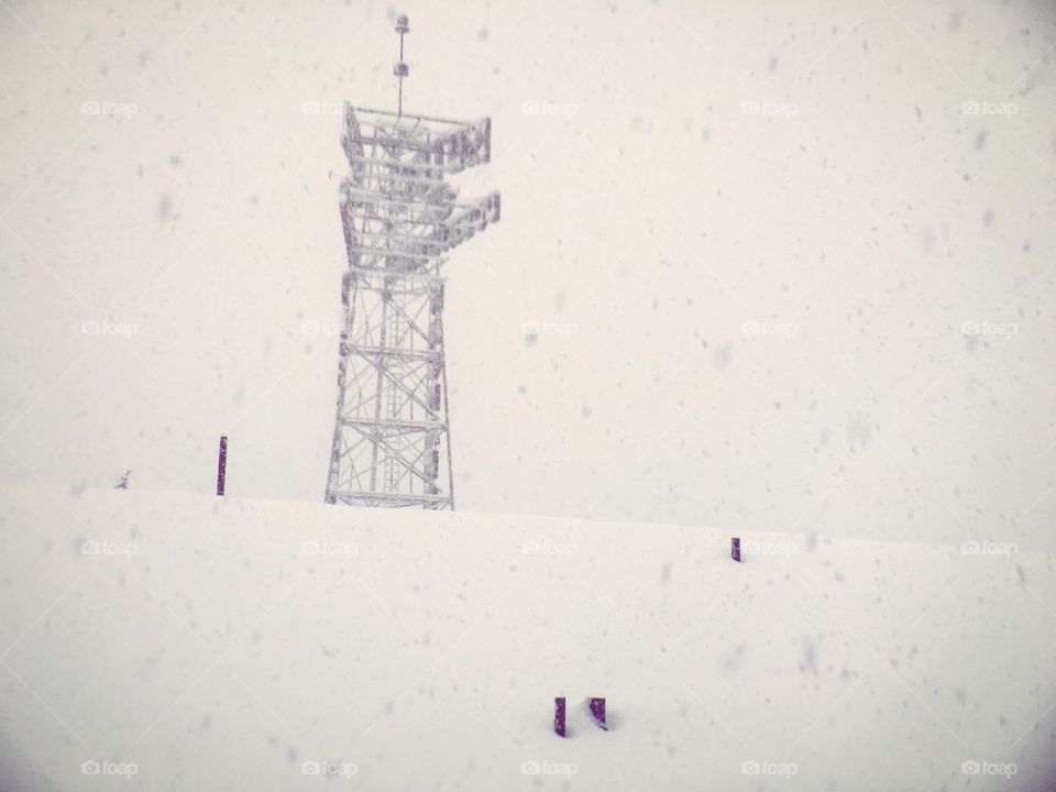 Snow covered tower