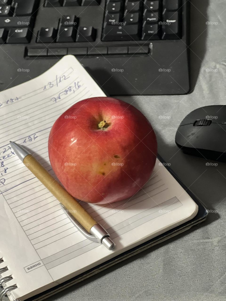 Working desk with notebook and pen 